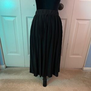 Pleated black skirt.